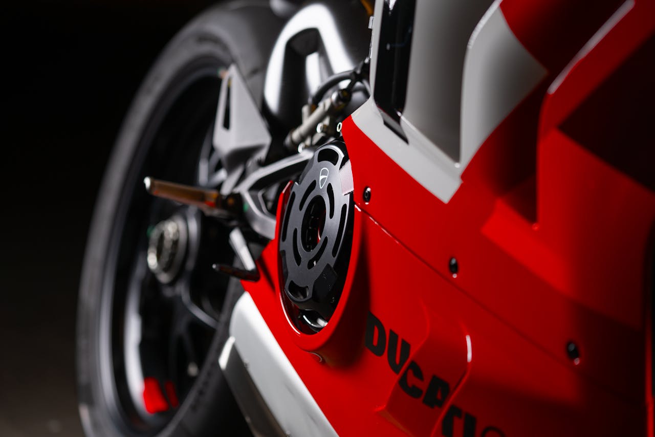 services-02 Detailed close-up of a red Ducati motorbike highlighting its design and style.