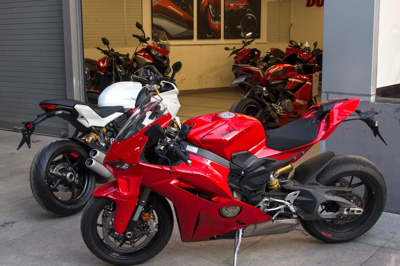 heros-img Sleek Ducati sports bikes showcased at a Bengaluru dealership. Perfect for motorcycle enthusiasts.
